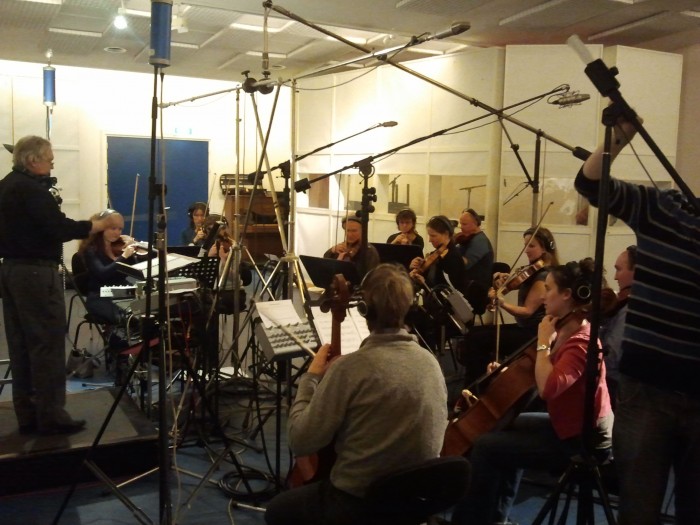 Jan Stulen conducting the orchestra at Power Sound Studio.